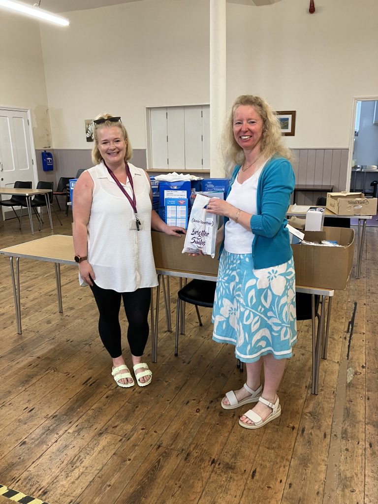 Lucy and Anna with oral health packs