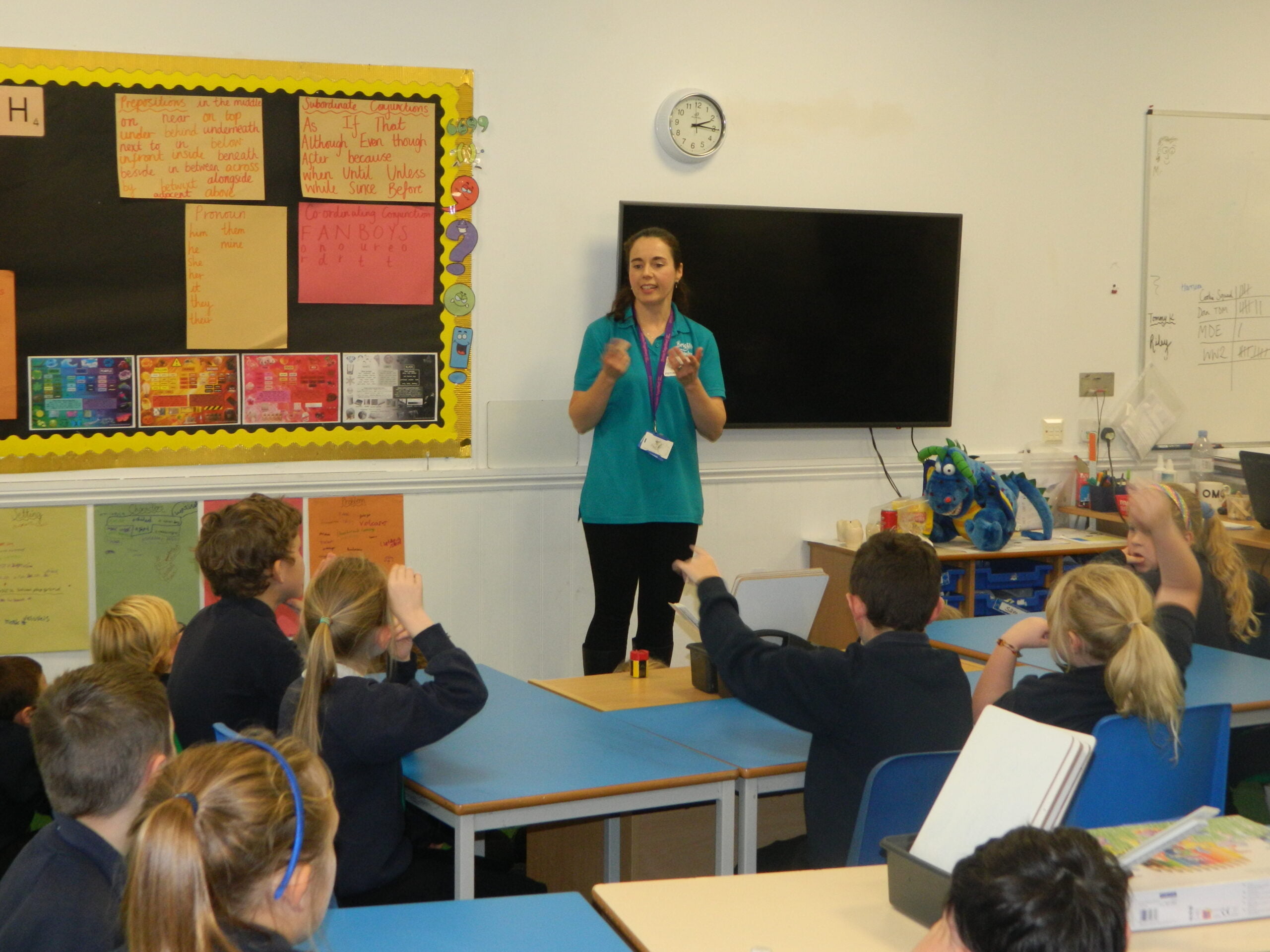 Brighter Smiles dental nurse Jo talking to children in classroom about oral health