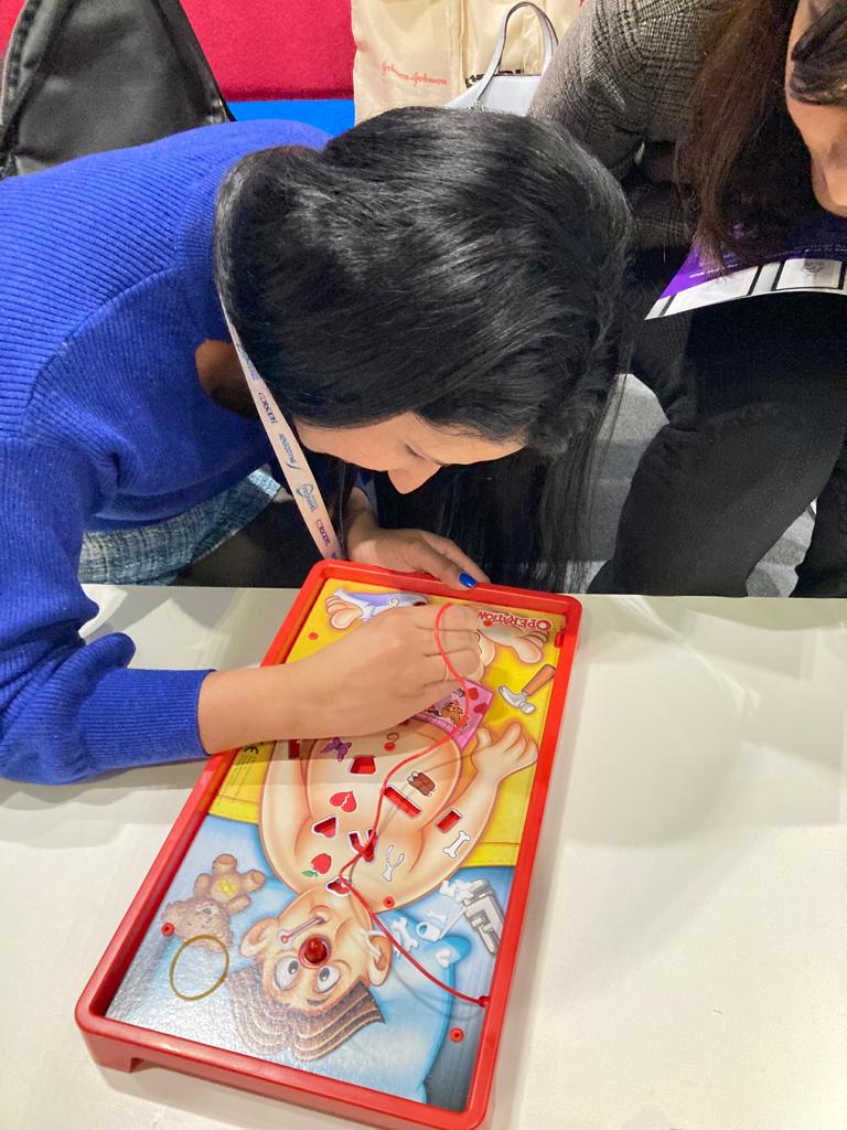 lady playing a game of operation for the steady handy competition