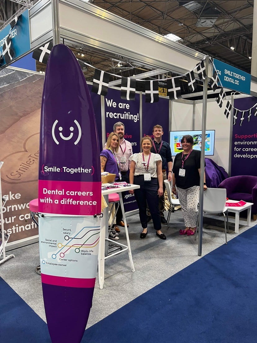 team in our Smile Together stand with our surfboard, Cornish bunting, purple furniture